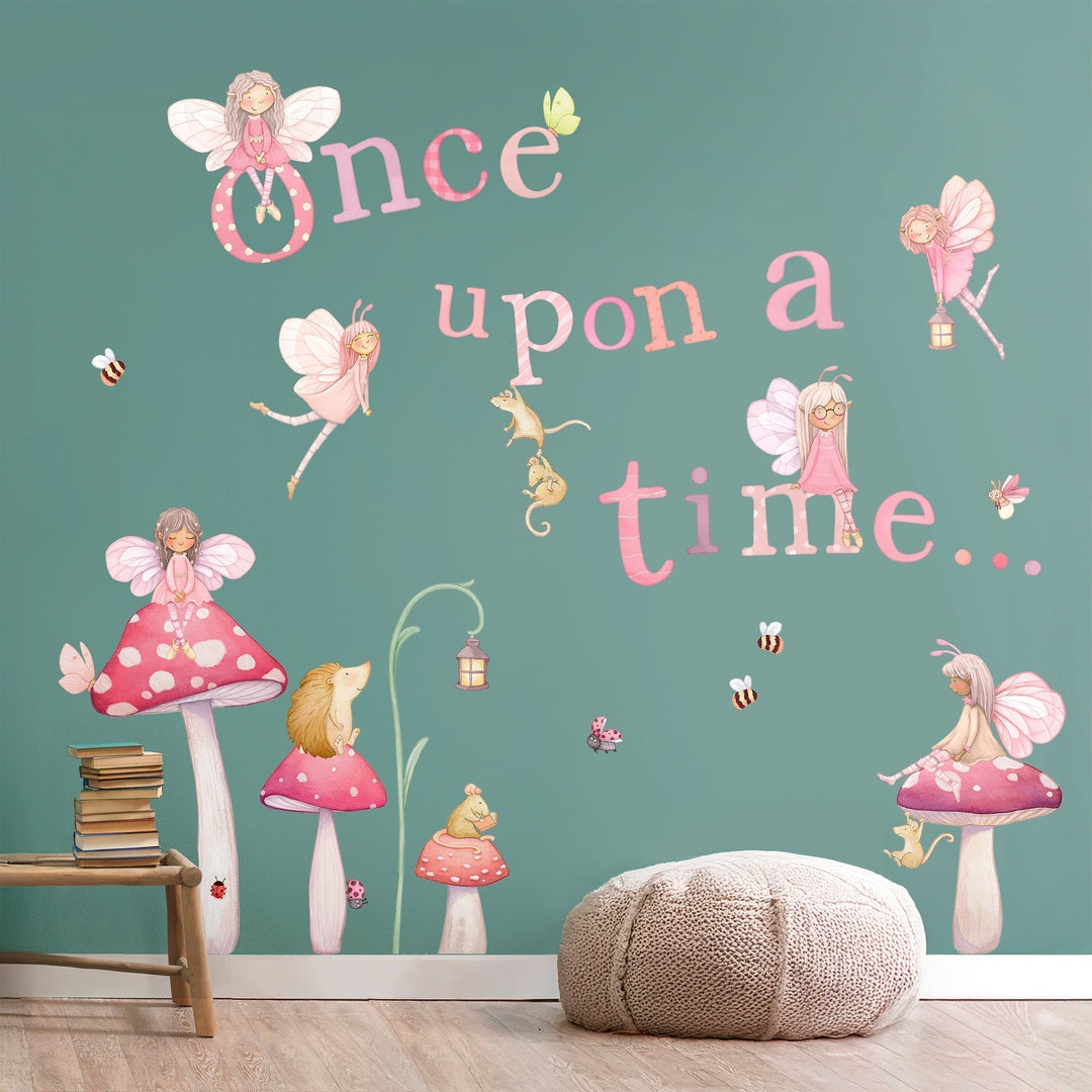 Fairies flying and sitting atop of toadstools with the words Once Upon a Time