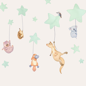 Children's wall decal with Australian animal illustrations and stars on a cream nursery wall