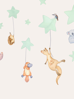 Children's wall decal with Australian animal illustrations and stars on a cream nursery wall