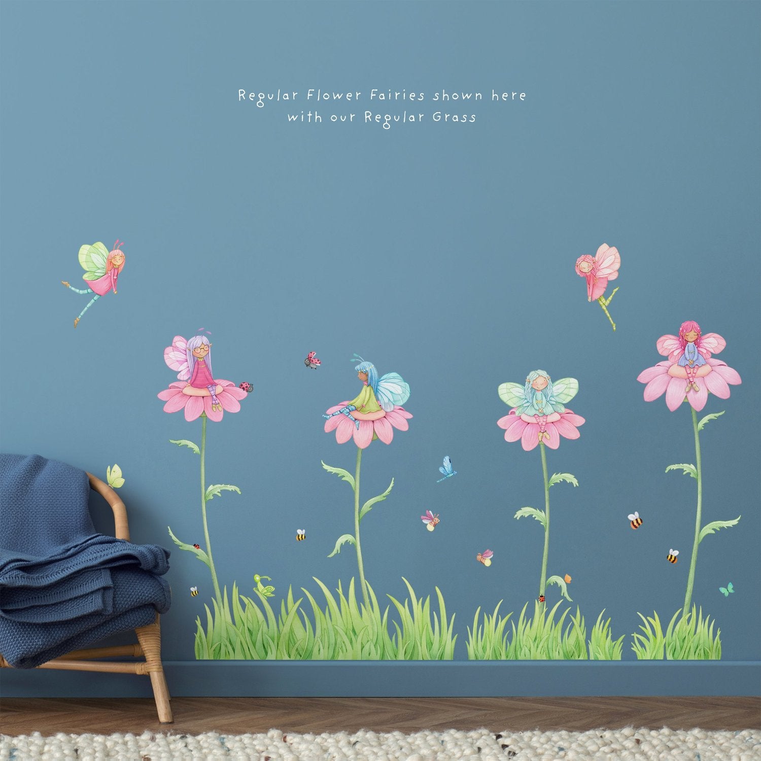 A childrens room with dark blue walls and high quality fairy wall stickers