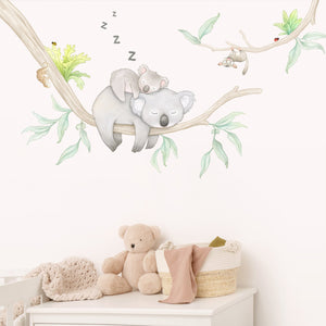 A Koala in a eucalyptus tree wall decal in a young child's bedroom