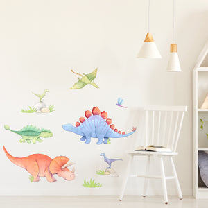 Colorful dinosaur wall decals including a stegosaurus and triceratops on a white wall