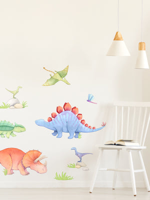 Colorful dinosaur wall decals including a stegosaurus and triceratops on a white wall