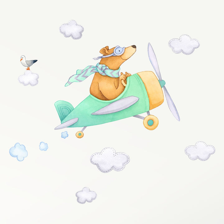A bear in a blue mint airplane decal