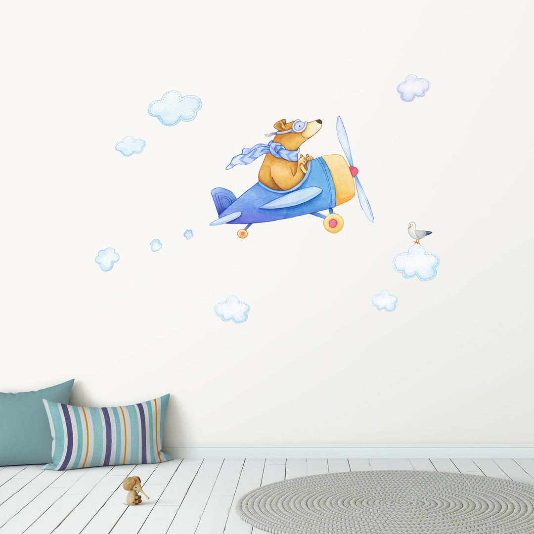 A bear in a blue airplane decal