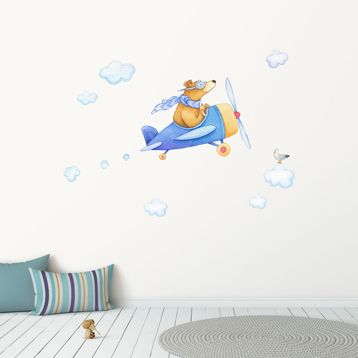 A bear in a blue airplane decal